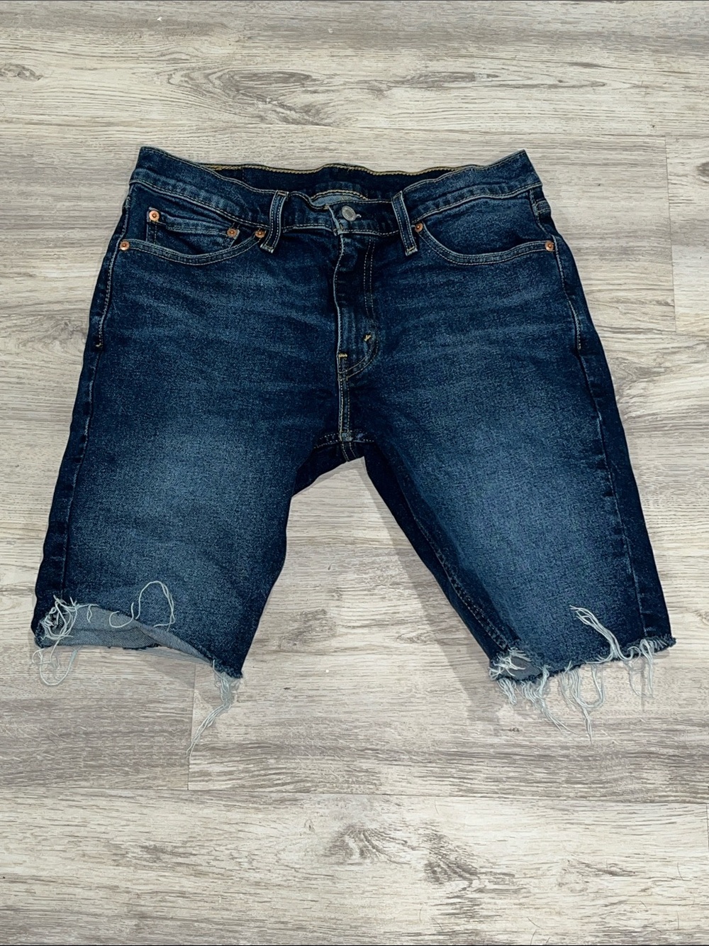 Levi's blue denim jean shorts with tan leather patch